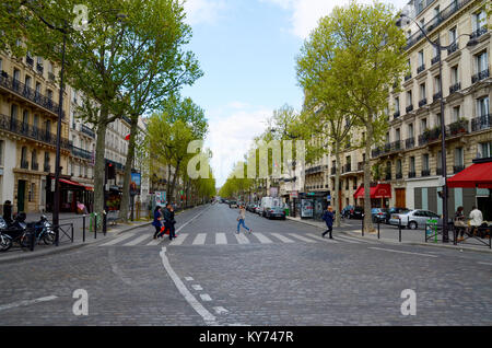 Avenue Bosquet, Paris, France. French street with people crossing the road, shops, cafes. Bistro du Monde. 7th arrondissement Stock Photo