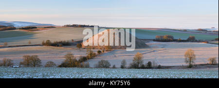 Silbury Hill in the winter at sunrise. Avebury, Wiltshire, England. Panoramic Stock Photo