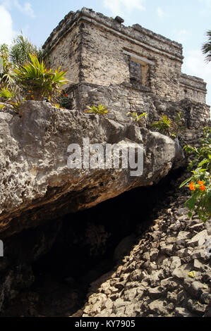 Big cave and small house in Tulum ruinas, Mexico Stock Photo