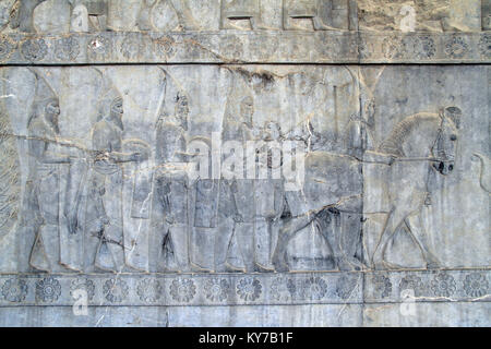 Bas-relief on the wall of palace in Persepolis, Iran Stock Photo