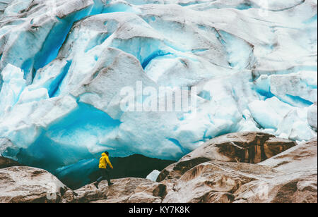 Man running at Nigardsbreen glacier  Travel Lifestyle ecology concept adventure extreme vacations outdoor nature in Norway Stock Photo