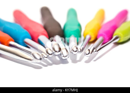 Different size crochet hooks for knitting isolated on white background Stock Photo