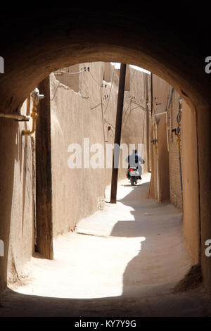 Bike on the street in old town Yazd, Iran Stock Photo