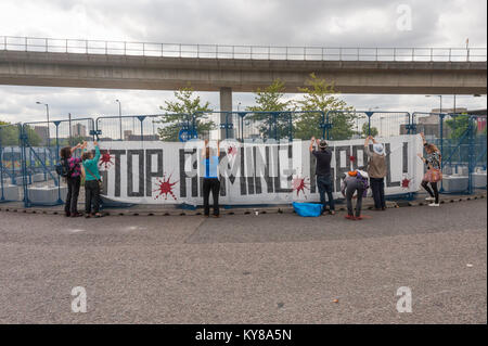 The protesters had hoped to set up camp on the roundabout, but ExCel had built a large fence around it, which was used to hold up the large 'Stop Arming Israel' banner. Stock Photo