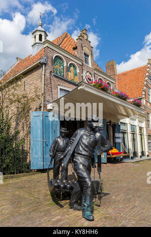 Statue of cheese carriers at the cheese market in Edam, Holland Stock Photo