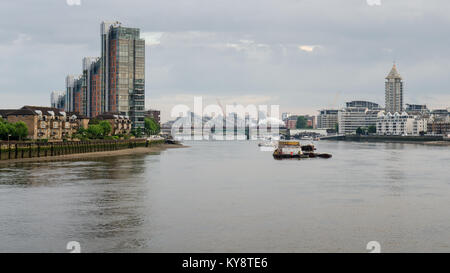 London, England, UK - May 29, 2014: A steam engine hauls a special passenger excursion train on a bridge over the River Thames on the West London Line Stock Photo