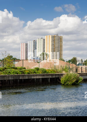 London, England, UK - July 28, 2013: Four council housing tower blocks rise behind the River Lee Navigation in Enfield, North London. Stock Photo