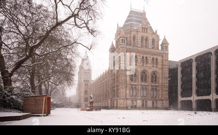 London, England, UK - January 18, 2013: Snow falls on the Natural History Museum in London's South Kensington museum district. Stock Photo