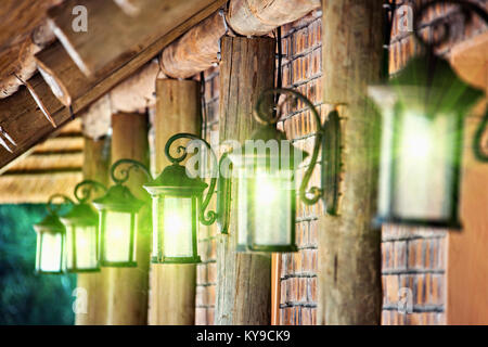 iron lamps on the wall of a traditional house Stock Photo