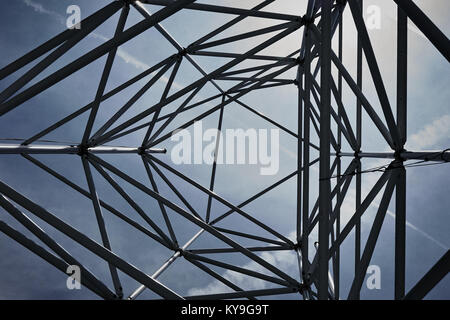 looking up to sky through open geometric structure Stock Photo