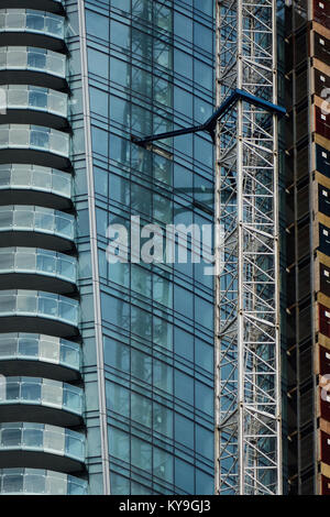 close-up of crane on side on glass building Stock Photo