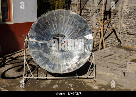 Eco-friendly solar heater for boiling water in the himalayan mountains in Nepal. Stock Photo