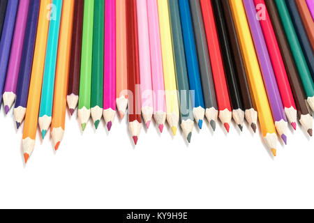 Lined in a row of colored pencils, sharpened side down, isolated on white background Stock Photo