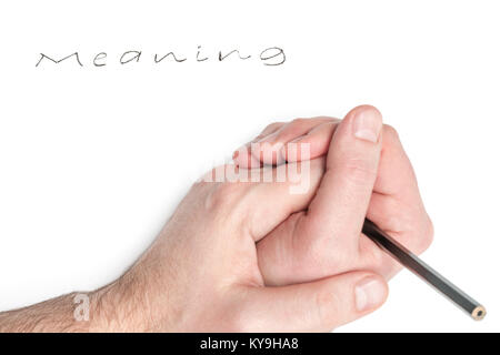 Hand in hand with a pencil near the word meaning, written by hand on a sheet, isolated on white background Stock Photo
