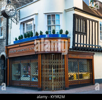 UK England, Suffolk, Bury St Edmunds, Abbeygate Street jeweller with shutters up on a Sunday, in historic timber framed building Stock Photo