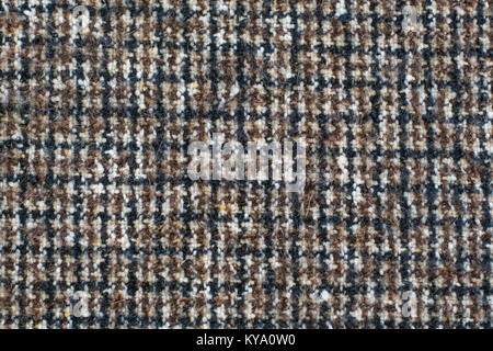 Wool or Tweed texture background. Fabric  checkered in brown. Houndstooth texture. Stock Photo