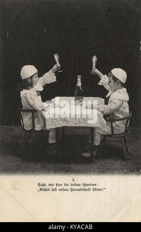 Photograph showing two individuals engaged in an activity, illustrating social interaction, behavior, and historical context in early 20th-century Europe. Stock Photo