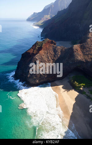 View from helicopter down to Honopu Beach and Arch at the Na Pali Coast in Kauai, Hawaii. Stock Photo