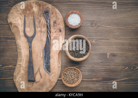 Cutting board with fork and knife Stock Photo