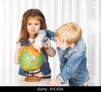 Kids on geography lesson Stock Photo