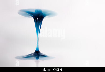 The viscous substance in the form of a colored gel is stretched between two planes Stock Photo