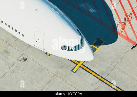 Aerial view of the airport. Airplane is preparation before take off. Stock Photo