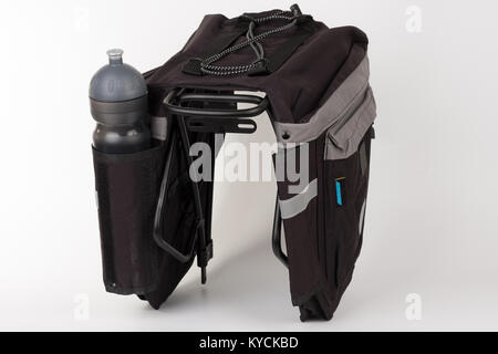 Bike carrier bag on rear rack , in pocket is water bottle, studio photo, isolated on white background Stock Photo
