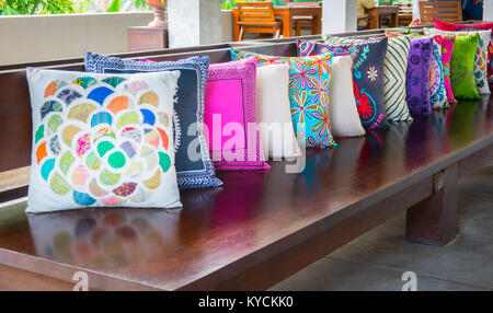 Decorative pillow natural Fabric on wood long chiar Stock Photo