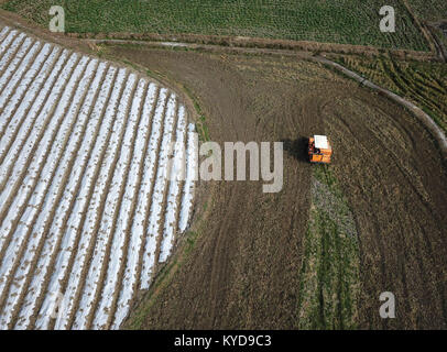 Qiandongnan, China's Guizhou Province. 14th Jan, 2018. Famers work in an edible mushroom field at Cenge Village in Nanming Township in Jianhe County, Qiandongnan Miao and Dong Autonomous Prefecture, southwest China's Guizhou Province, Jan. 14, 2018. Credit: Yang Wenbin/Xinhua/Alamy Live News Stock Photo