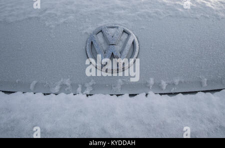 Detroit, USA. 14th Jan, 2018. The logo of a Volkswagen is covered in ice crystals on the forecourt of a dealership in Detroit, Michigan, USA, on 14 January 2018. Credit: Boris Roessler/dpa/Alamy Live News Stock Photo