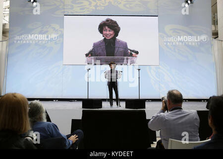 Detroit, USA. 14th Jan, 2018. U.S. Secretary of Transportation Elaine Chao (C) speaks during an event called 'AutoMobili-D' ahead of North American International Auto Show(NAIAS) at Cobo Center in Detroit, the United States, on Jan. 14, 2018. Elaine Chao said on Sunday the Trump administration plans to unveil revised self-driving car guidelines this summer to give carmakers more freedom to develop self-driving car technologies. Credit: Wang Ping/Xinhua/Alamy Live News Stock Photo