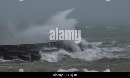 Brighton, UK. 15th Jan, 2018. Waves crash over Brighton Marina as gales and heavy rain batter the south coast this morning with colder weather forecast to hit Britain later in the week Credit: Simon Dack/Alamy Live News Stock Photo