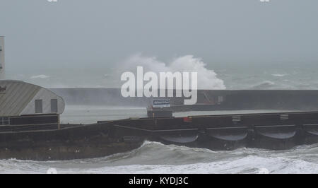 Brighton, UK. 15th Jan, 2018. Waves crash over Brighton Marina as gales and heavy rain batter the south coast this morning with colder weather forecast to hit Britain later in the week Credit: Simon Dack/Alamy Live News Stock Photo