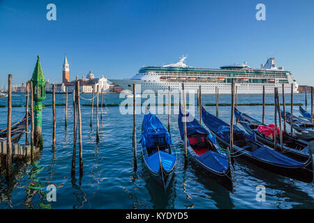 The Royal Caribbean cruise ship Rhapsody of the Seas and gondolas in Veneto, Venice, Italy, Europe. Stock Photo