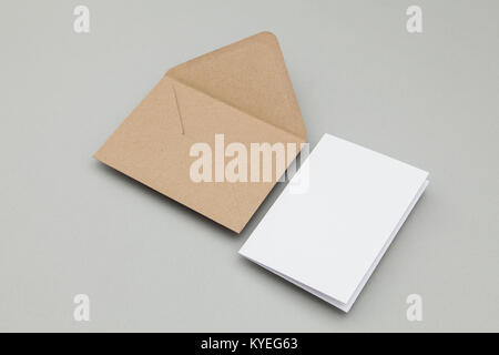 Blank white card with kraft brown paper envelope template mock up Stock Photo