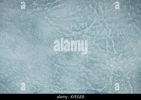 The colored heterogeneous leather texture. The fabric in light, dark blue and white tints. Artistic retouching. Perfect background for the different k Stock Photo