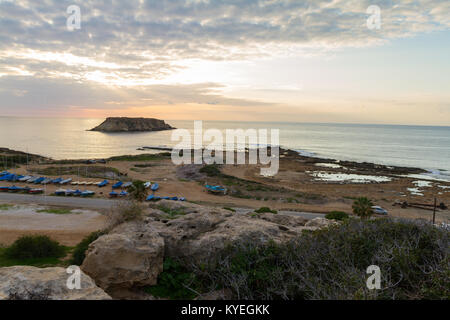 WInter sunset at Agios Georgios Pegeias Fishing harbor in Paphos, Cyprus Stock Photo