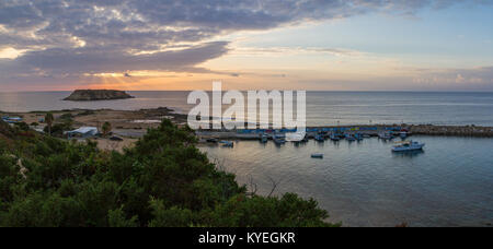 Panorama of a sunset at Agios Georgios Pegeias Fishing harbor in Paphos, Cyprus Stock Photo