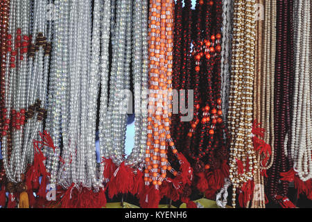Lots of garlands glittering  hanging for sell in stall in Rishikesh. Stock Photo