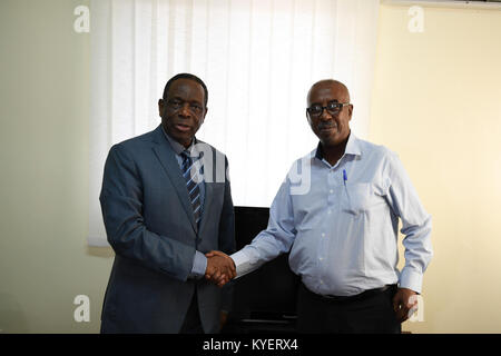 The Special Representative of the Chairperson of the African Union Commission (SRCC) for Somalia, Ambassador Francisco Madeira (left) and the Somali Federal Minister of Constitutional Affairs, Mr. Abdurahman Hosh Jibril (right). This was at the end of a meeting at the African Union Mission in Somalia (AMISOM) headquarters in Mogadishu, Somalia on August 08, 2017. AMISOM Photo / Ilyas Ahmed Stock Photo