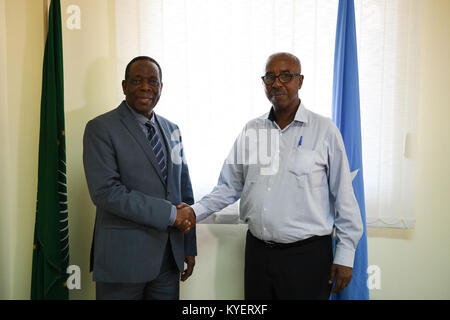 The Special Representative of the Chairperson of the African Union Commission (SRCC) for Somalia, Ambassador Francisco Madeira (left) and the Somali Federal Minister of Constitutional Affairs, Mr. Abdurahman Hosh Jibril (right). This was at the end of a meeting at the African Union Mission in Somalia (AMISOM) headquarters in Mogadishu, Somalia on August 08, 2017. AMISOM Photo / Ilyas Ahmed Stock Photo