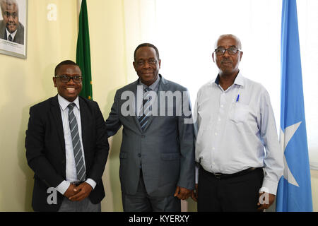 The Special Representative of the Chairperson of the African Union Commission (SRCC) for Somalia, Ambassador Francisco Madeira (middle), the Somali Federal Minister of Constitutional Affairs, Mr. Abdurahman Hosh Jibril (right) and the Director General of the Ministry of Constitutional Affairs, Mohamed Abukar Zubeyr (left). This was at the end of a meeting at the African Union Mission in Somalia (AMISOM) headquarters in Mogadishu, Somalia on August 08, 2017. AMISOM Photo / Ilyas Ahmed Stock Photo