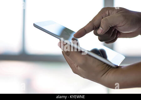 man touch tablet, laptop connecting wifi technology business people workspace Stock Photo