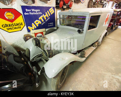 Photograph of a UNIC ambulance displayed at the Fahrzeugmuseum Marxzell, showcasing the vintage vehicle in a museum setting. Stock Photo