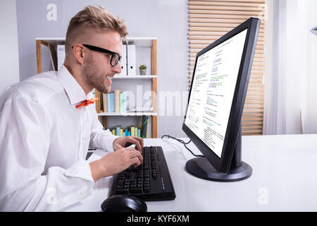 Funny Businessman Working On Computer In Office Stock Photo