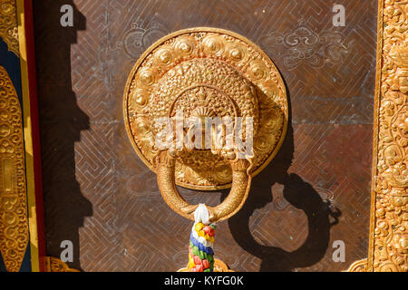 A handle on the door of a Buddhist temple, Nepal Stock Photo