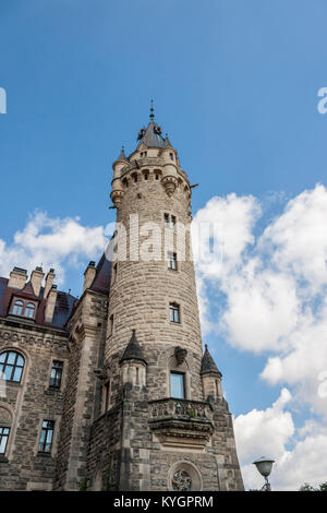 MOSZNA, POLAND - AUGUST 7: Part of the Moszna Castle is a historic castle located in a small village on august 7, 2016 in Moszna. The castle is one of Stock Photo