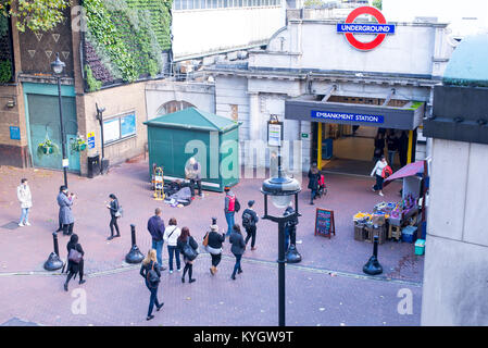 London, UK - October 2017: Tourists and commuters walking in front of the Embankment subway station in central London, UK. Stock Photo