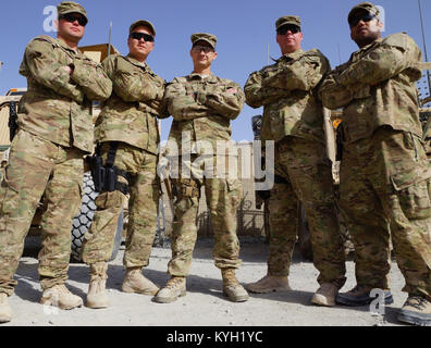 Air Force Staff Sgt. Jonathon Stribling (second from left) of Louisville, Ky. poses for a group photo with the Airmen of the Kentucky National Guard’s Agribusiness Development Team 4 in southern Afghanistan on March 6, 2012. Stribling, a member of the Louisville, Ky. based 123rd Aerial Port Squadron, is currently serving on his second deployment. Also pictured (from left): Staff Sgt. Austin McDonald of Louisville, Ky.; Tech. Sgt. Bucky Harris of Lietchfield, Ky.; Staff Sgt. Jeff Ward of Georgetown, Ky.; and Staff Sgt. Raphael Williams of Louisville, Ky. (Photo by U.S. Army Staff Sgt. Paul Evan Stock Photo