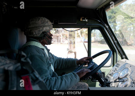 Army Sgt. Billy Artis, a transporter from the 690th Rapid Port Opening Element, drives cargo from the marshaling yard at Lakehurst Naval Air Engineering Station, N.J., to a forward distribution node during Exercise Eagle Flag March 27, 2012.  The Kentucky Air National Guard's 123rd Contingency Response Group from Louisville, Ky., and the 690th from Fort Eustis, Va., joined forces for the exercise to form a Joint Task Force-Port Opening. (U.S. Air Force photo by Master Sgt. Phil Speck) Stock Photo